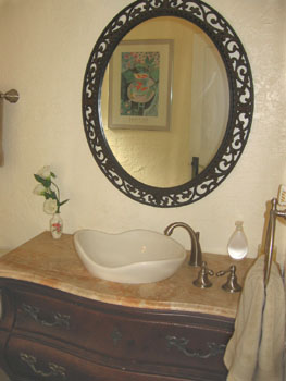 The vanity made from an old chest has two working drawers.