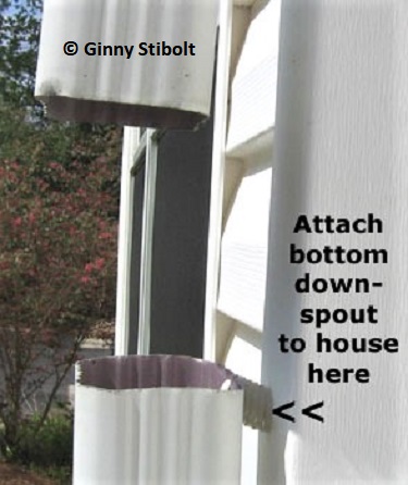 Cut a gap in the downspout an inch or two smaller than the height of the catch basin.  Photo by Stibolt.