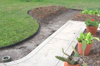 Expanding the vegetable garden including a path.  Photo by Stibolt