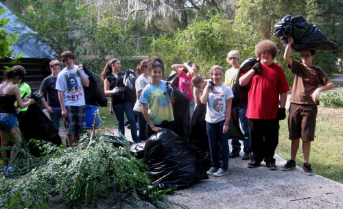At the end of an afternoon of pulling a digging, 15 bags of invasive plants were removed from this historic property.  Photo by Stibolt