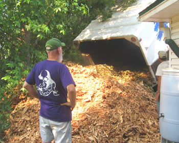 The mulch gets dumped on the driveway. Photo by Stibolt